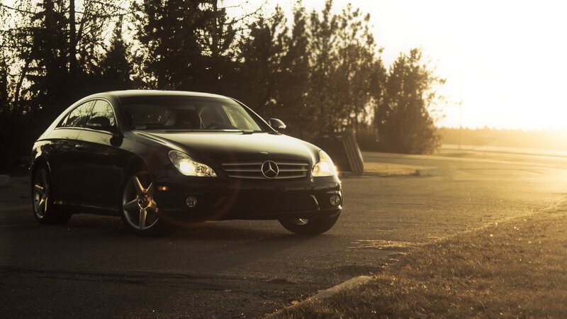 Black Mercedes-Benz at sunset