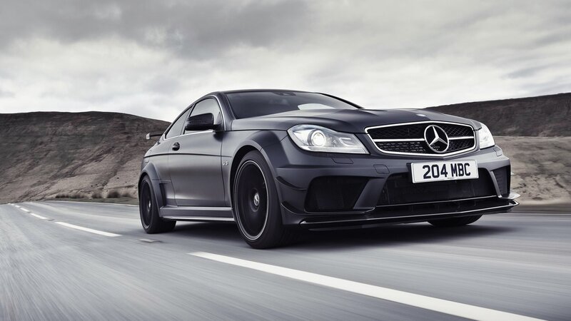Black Mercedes-Benz C63 AMG on road
