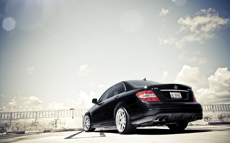 Black Mercedes-Benz C63 on a bridge