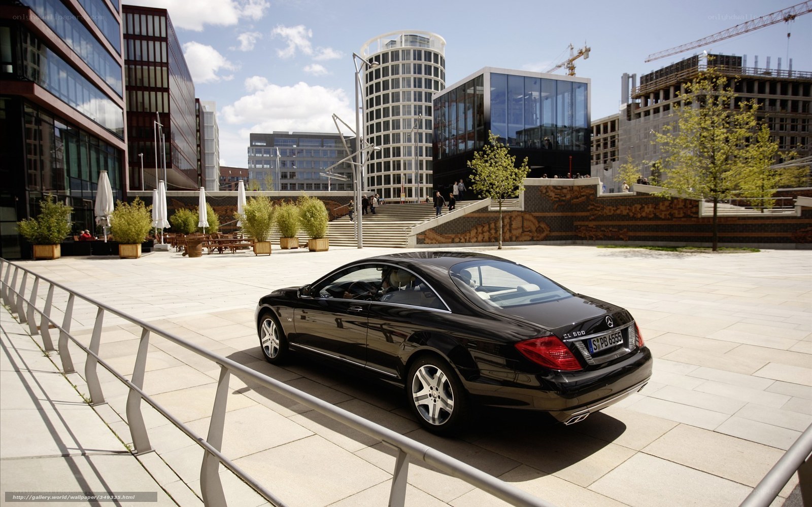 Black Mercedes-Benz CL500 in city plaza