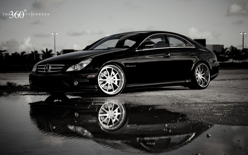 Black Mercedes-Benz CLS in a puddle