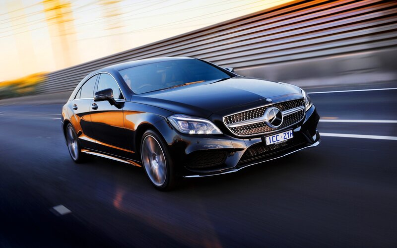 Black Mercedes-Benz CLS in motion