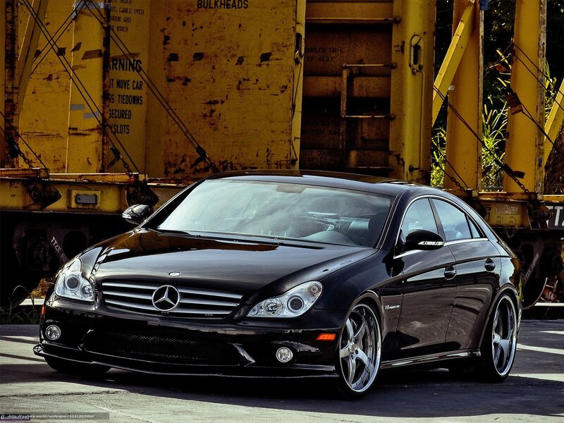 Black Mercedes-Benz CLS parked near train