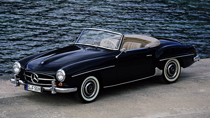Black Mercedes-Benz convertible by water