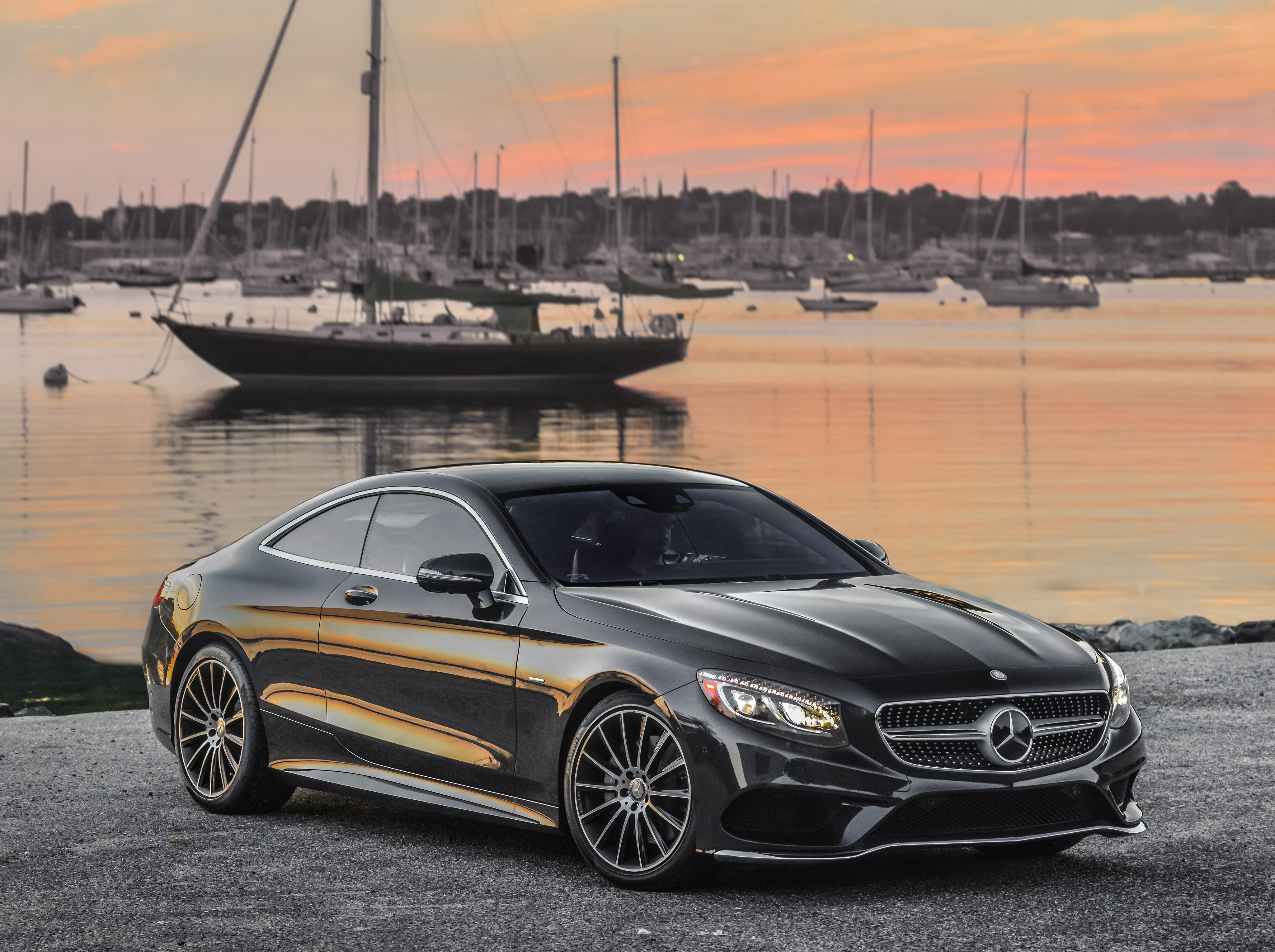 Black Mercedes-Benz coupe at sunset