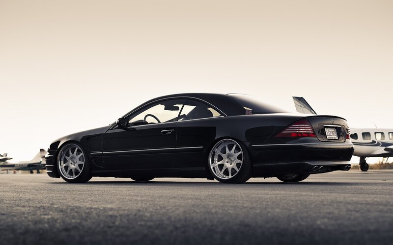 black mercedes-benz coupe on tarmac