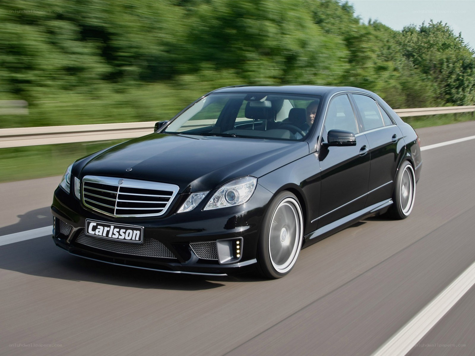 Black Mercedes-Benz E-Class in motion
