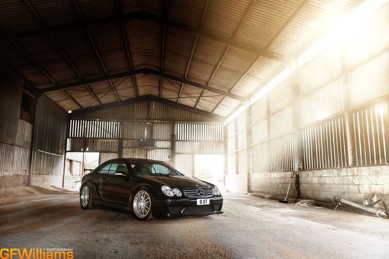 Black Mercedes-Benz in a barn