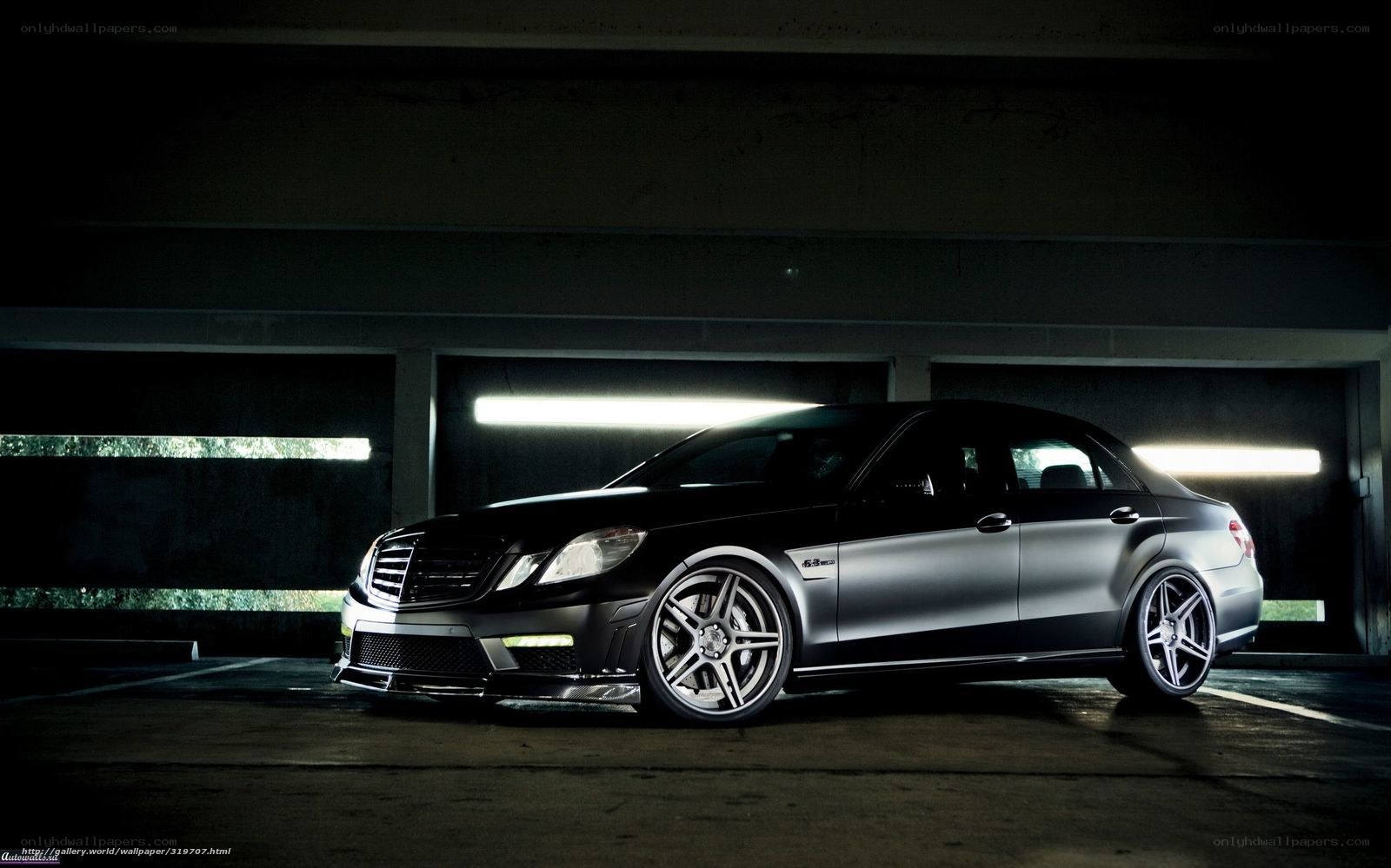 black mercedes-benz in garage