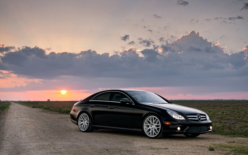 Black Mercedes-Benz on a dirt road