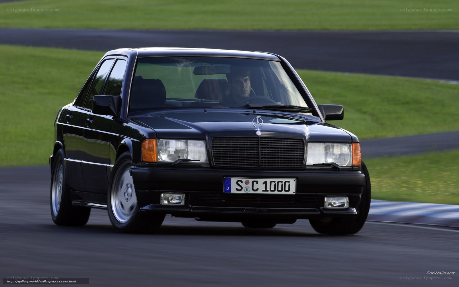 Black Mercedes-Benz on a racetrack