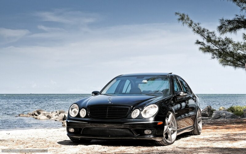 Black Mercedes-Benz on beach