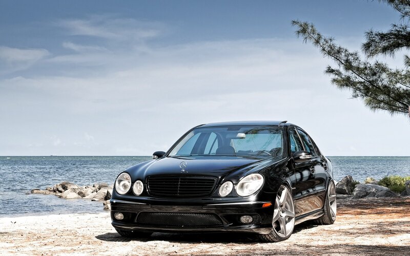 Black Mercedes-Benz on beach
