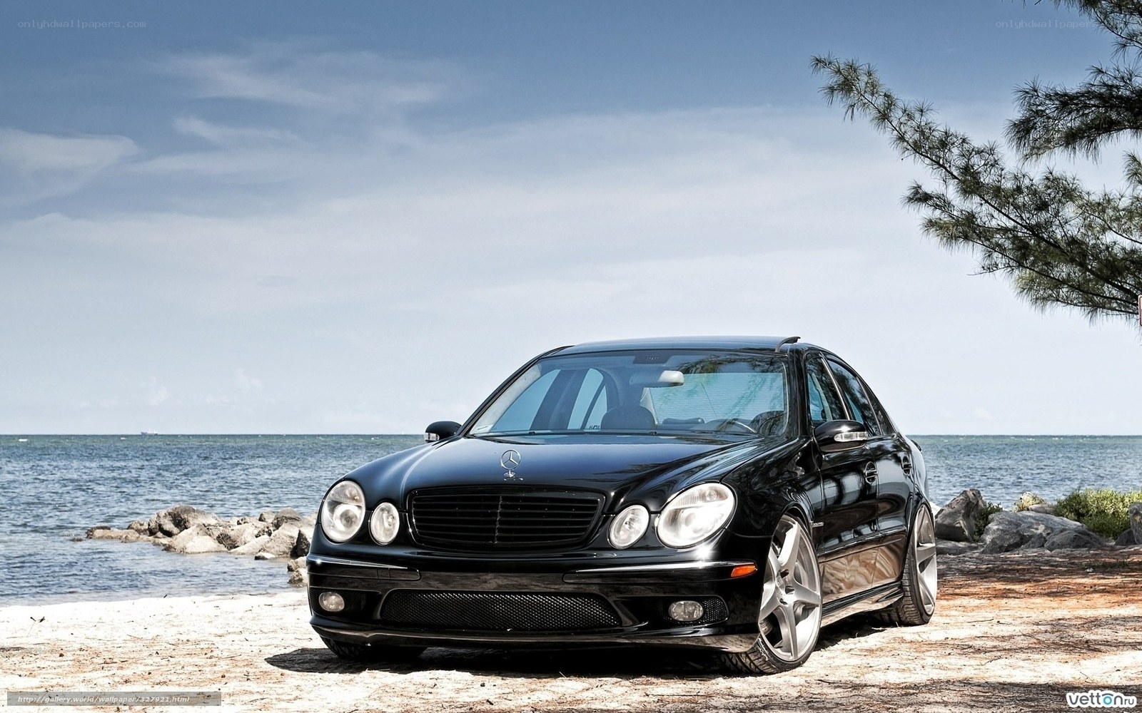 Black Mercedes-Benz on beach