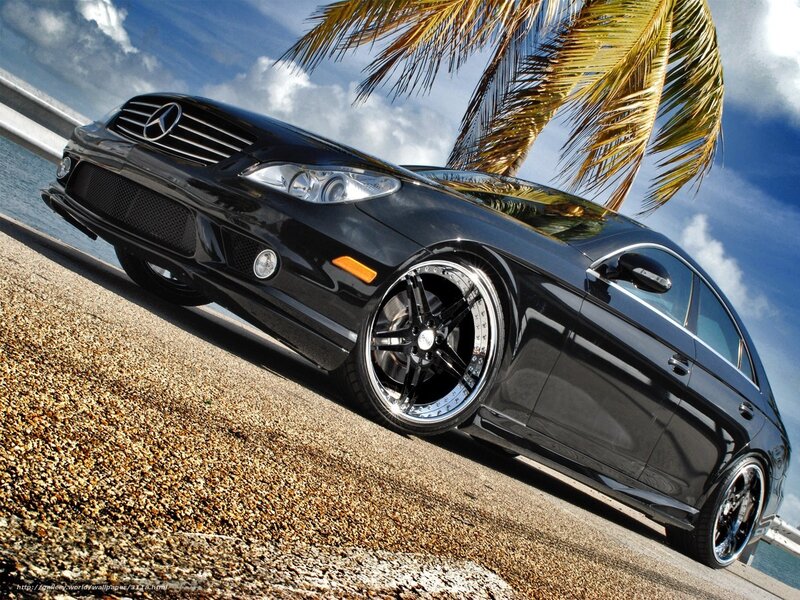 Black Mercedes-Benz on beachside road