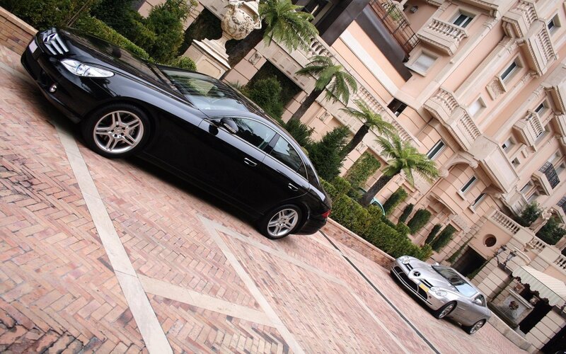 Black Mercedes-Benz on brick driveway