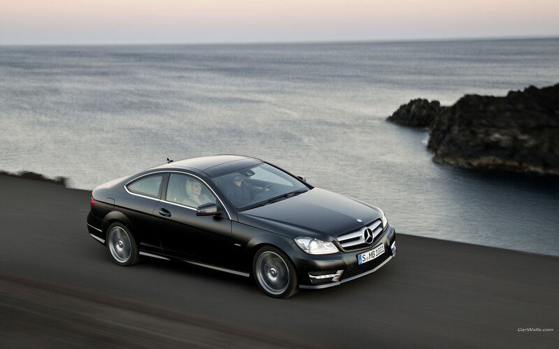 Black Mercedes-Benz on coastal road