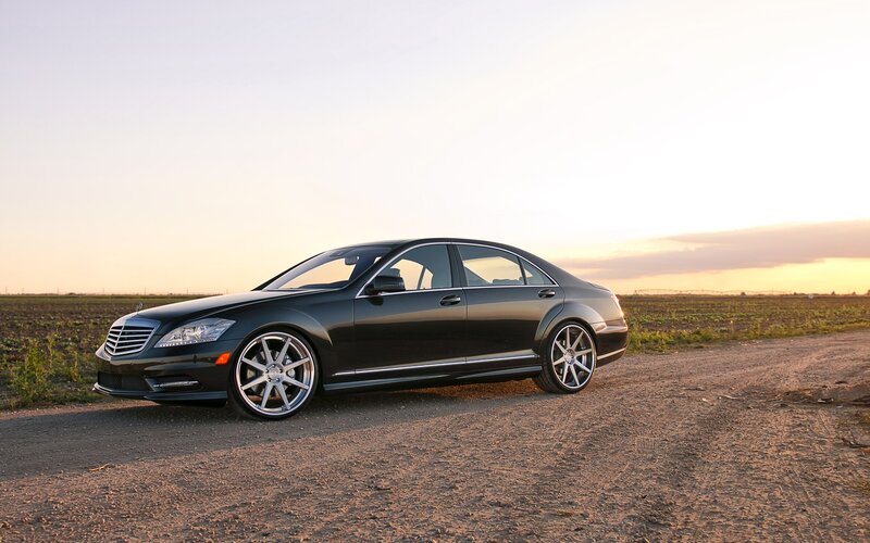 Black Mercedes-Benz on dirt road