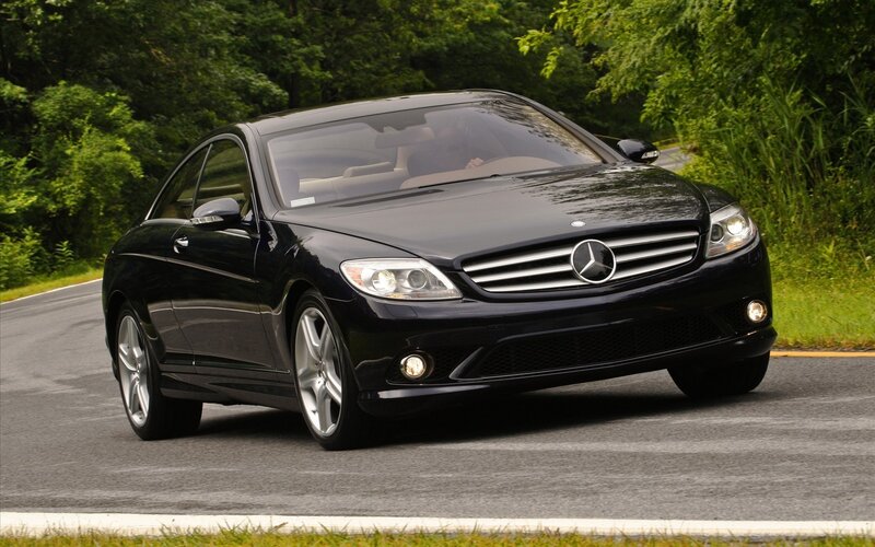 black mercedes-benz on road