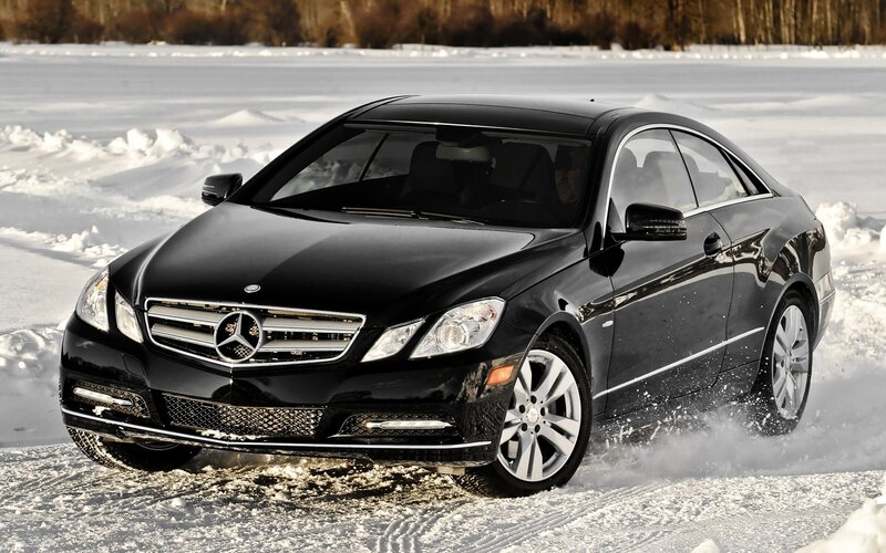 Black Mercedes-Benz on snowy road