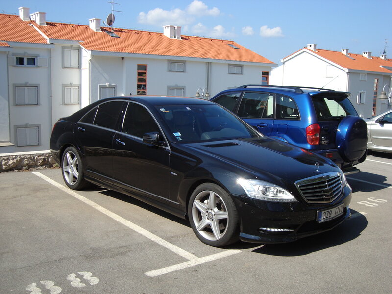 Black Mercedes-Benz parked in lot