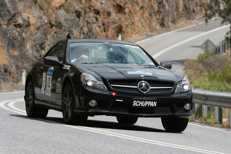 Black Mercedes-Benz racing on a road