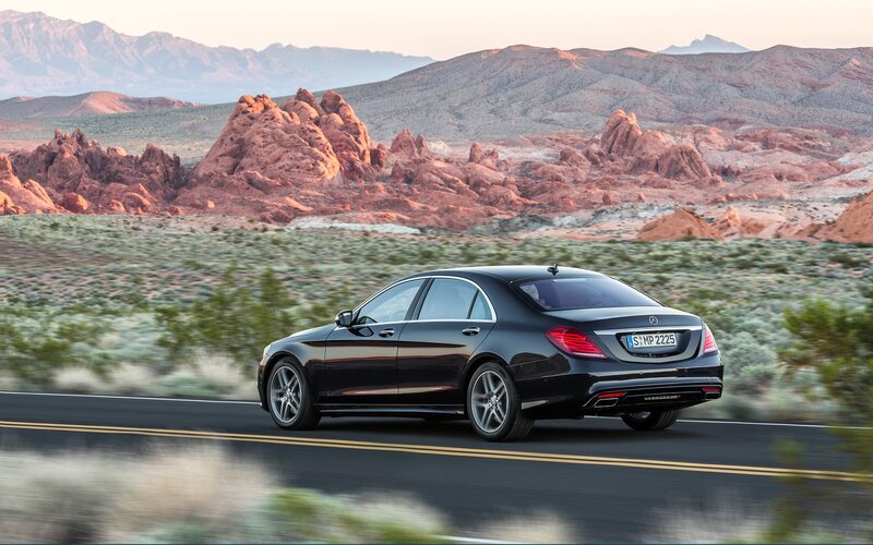 Black Mercedes-Benz S-Class on desert road