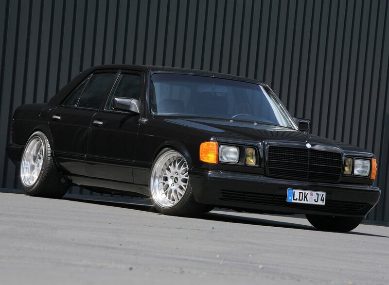 black mercedes-benz sedan