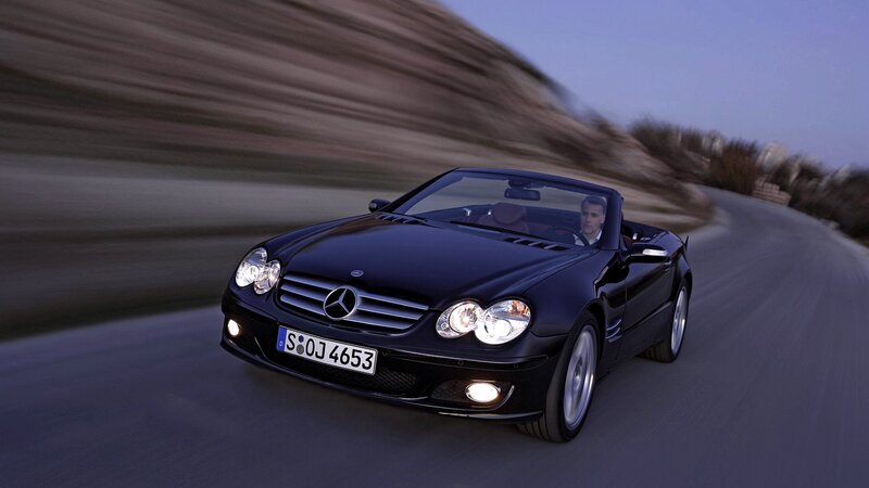 Black Mercedes-Benz SLK driving on road