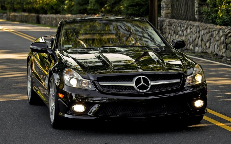 Black Mercedes-Benz SLK on a road