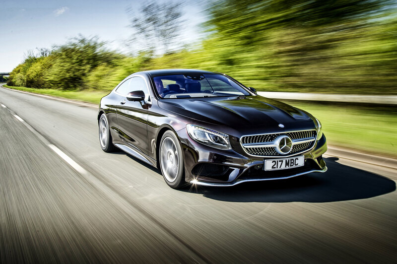 Black Mercedes-Benz speeding on road