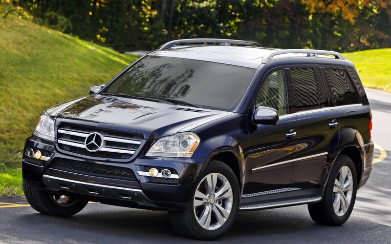 black mercedes-benz suv on road