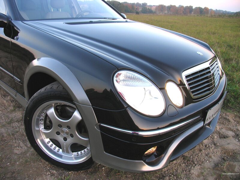 black mercedes-benz with custom wheels