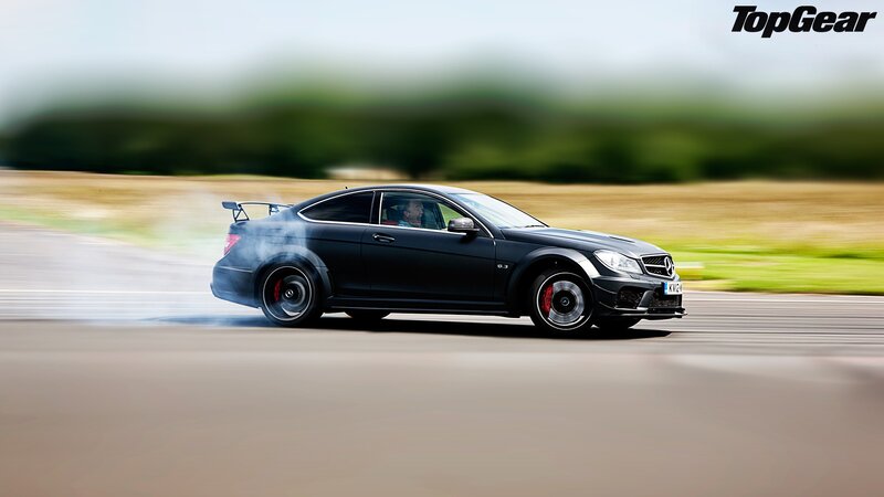 black mercedes c63 amg drifting