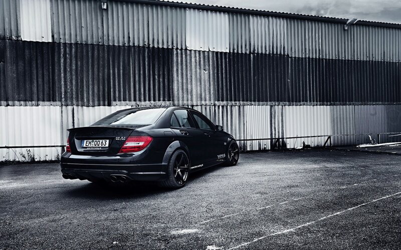 black mercedes c63 amg parked
