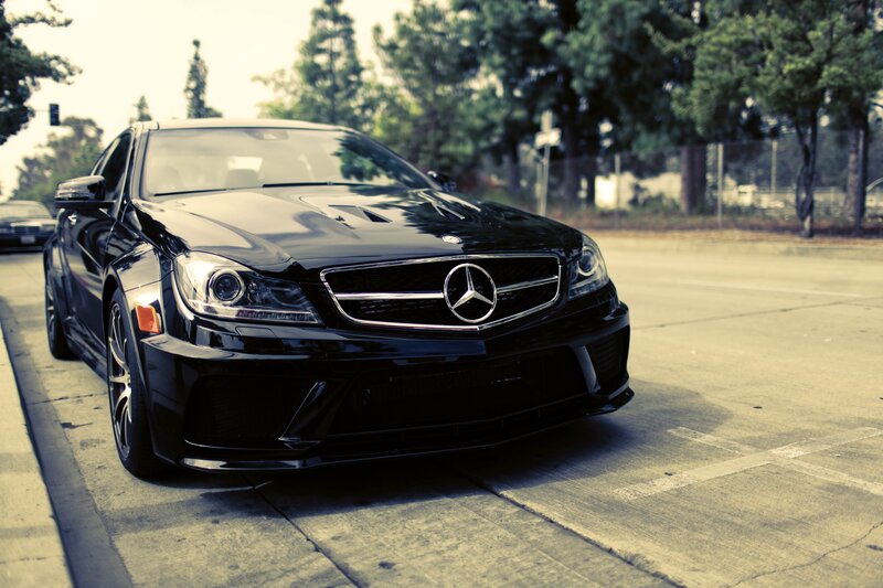 black mercedes c63 amg parked