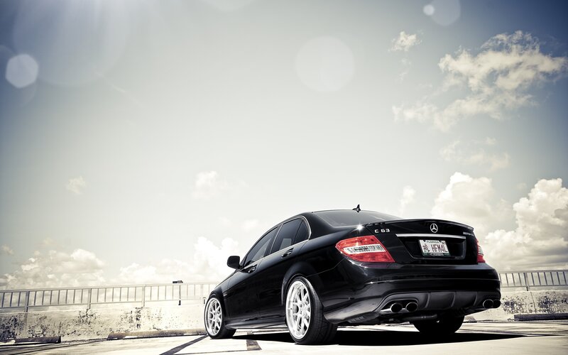 black mercedes c63 on a bridge