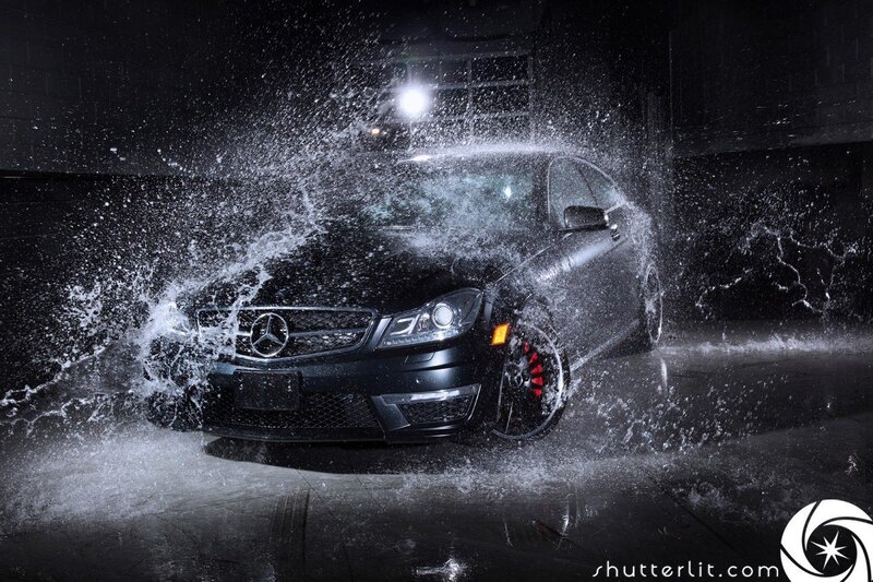 Black Mercedes car in water splash