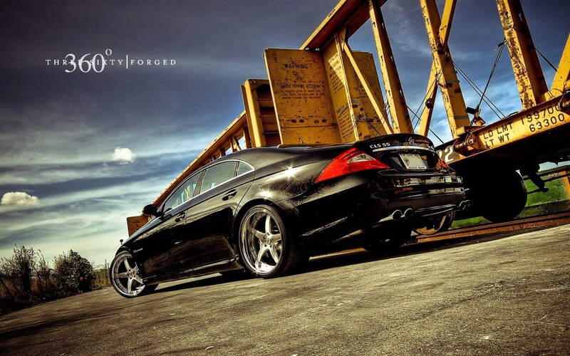 Black Mercedes CLS 55 on a train yard