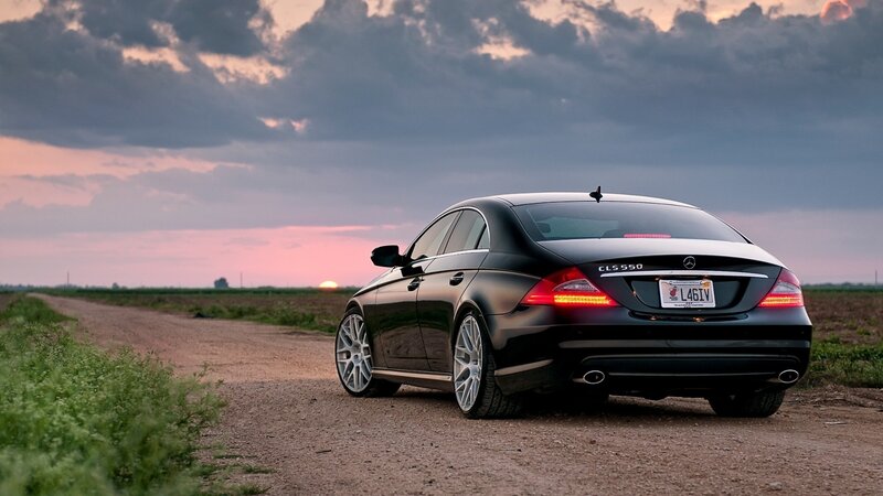 Black Mercedes CLS on dirt road