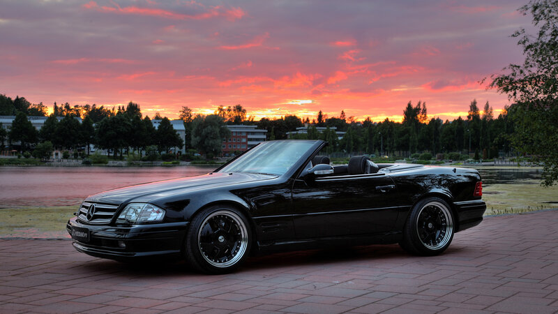 Black Mercedes convertible at sunset
