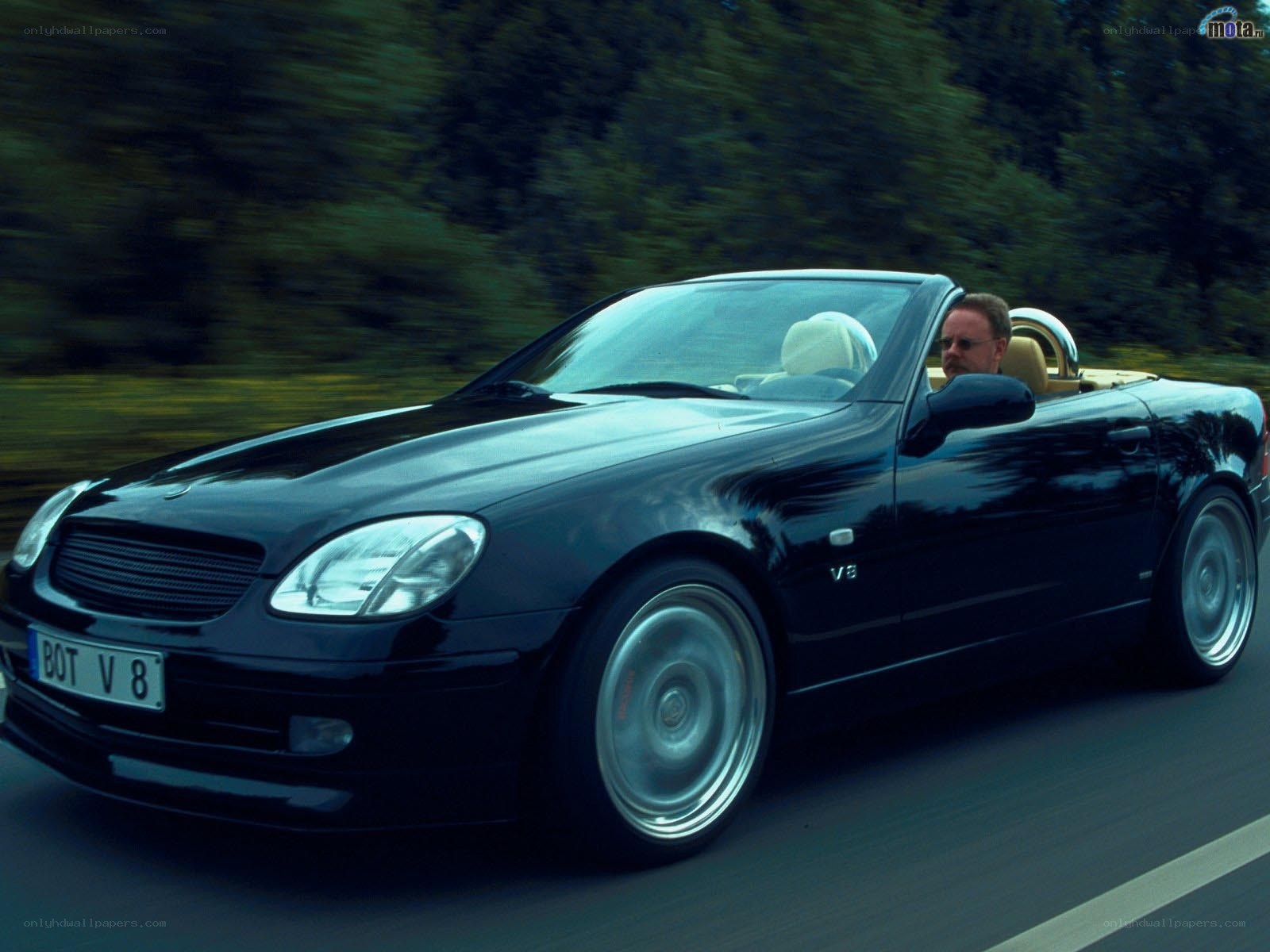 black mercedes convertible driving