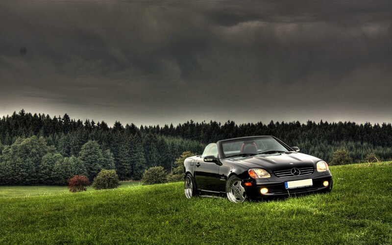 Black Mercedes convertible on a hill