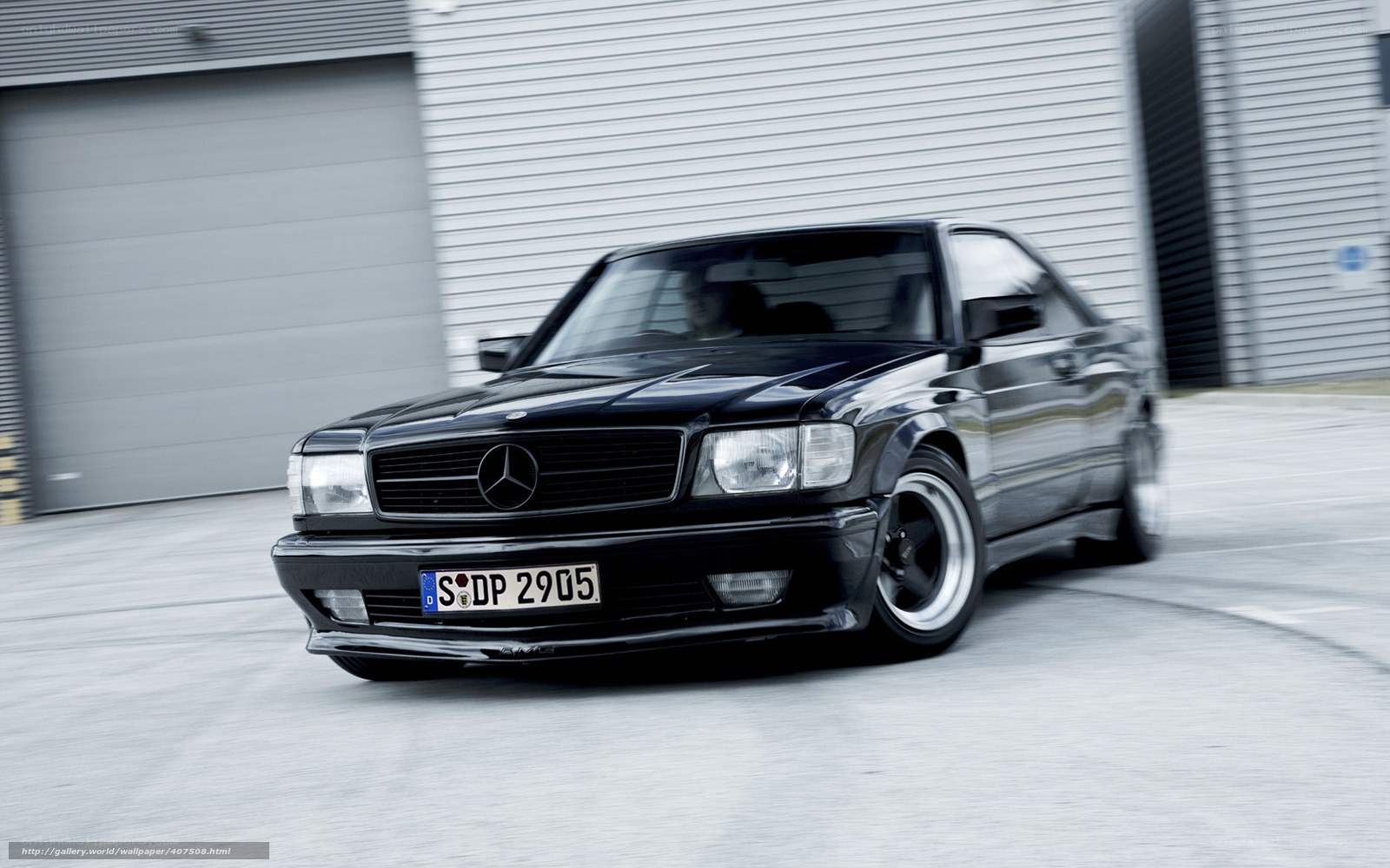black mercedes coupe in motion