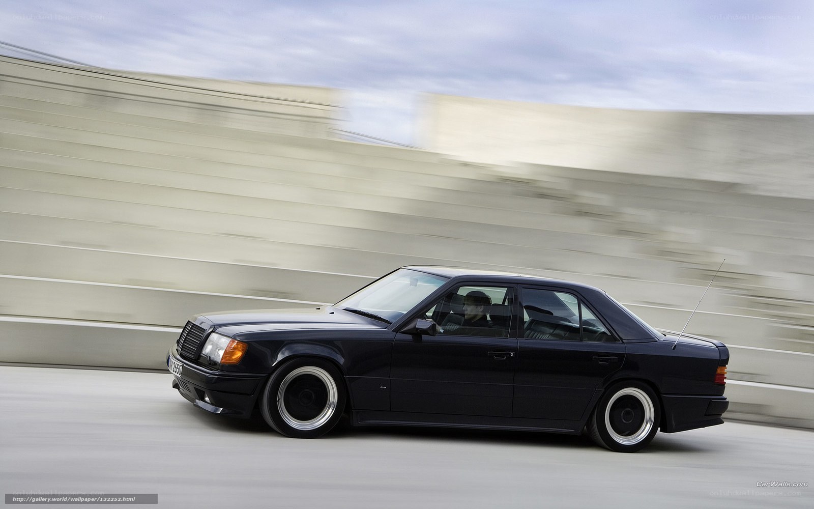 black mercedes driving on road