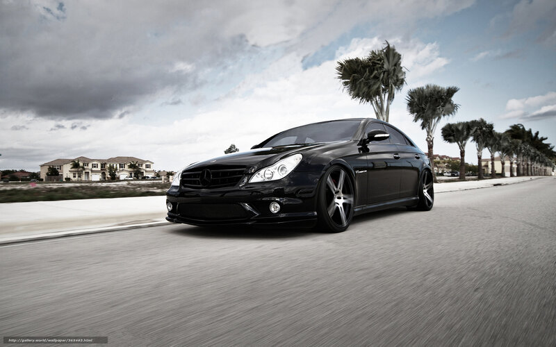 black mercedes driving on street