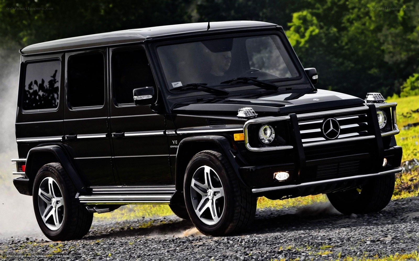Black Mercedes G-Wagon on gravel