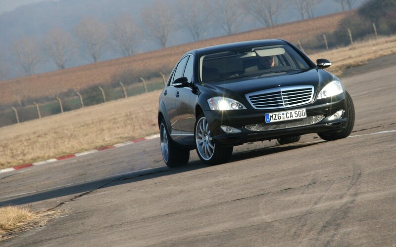 black mercedes on racetrack