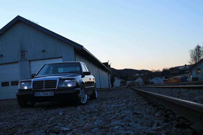 Black Mercedes on Train Tracks — Blue