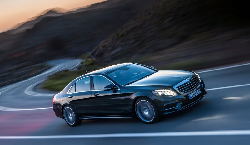 black mercedes on winding road